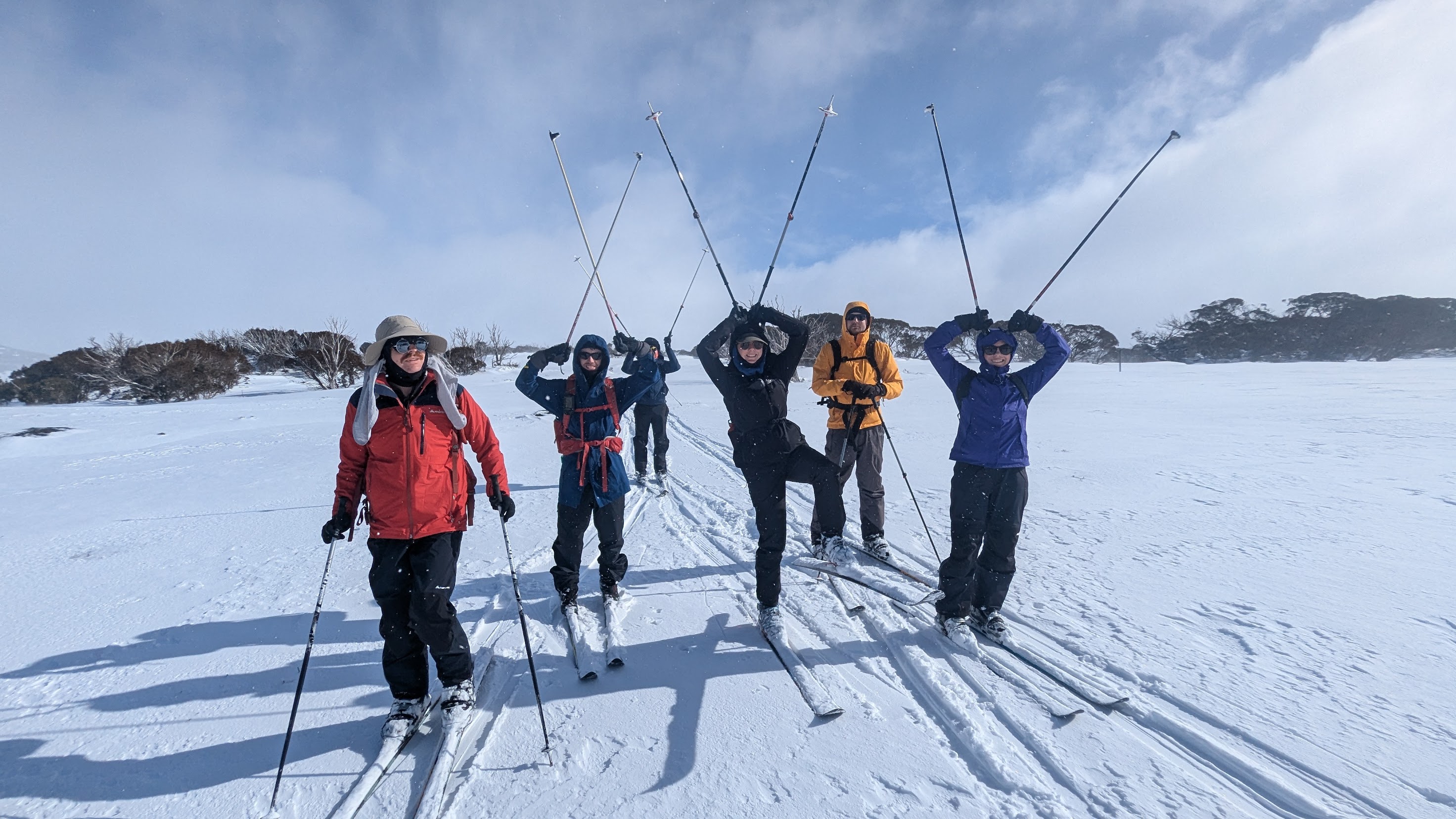 Skiing group striking a pose